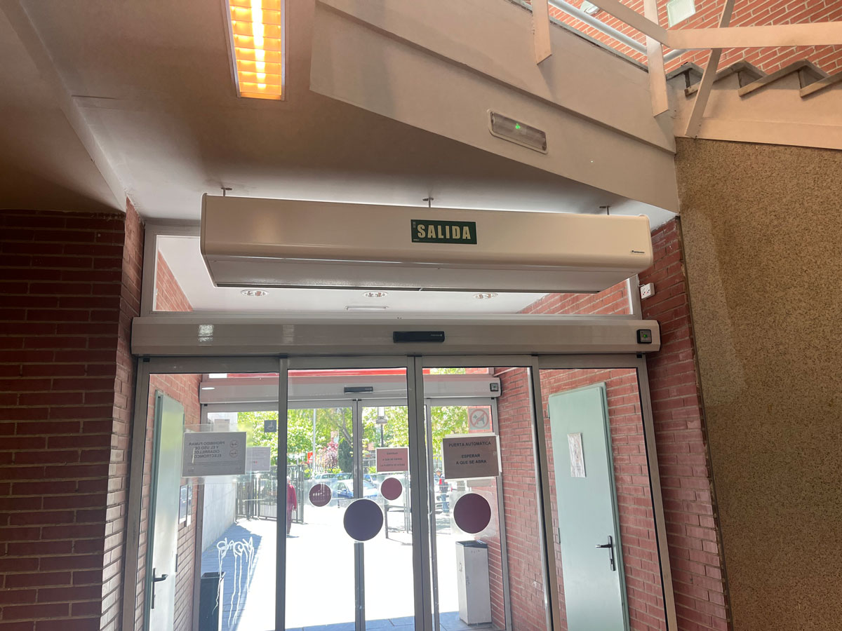 Custom Smart air curtain with Exit sign on the automatic door of the Antonio Mingote library.